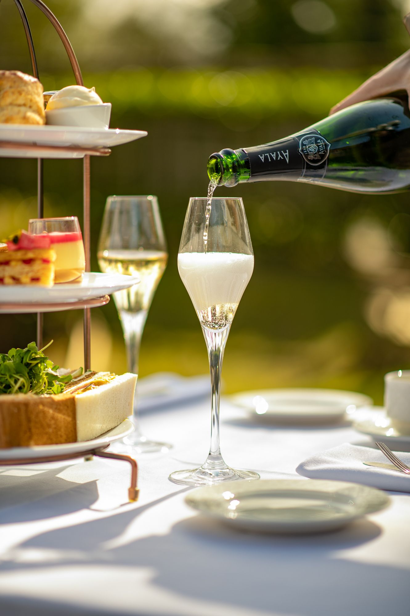 Afternoon tea pouring champagne