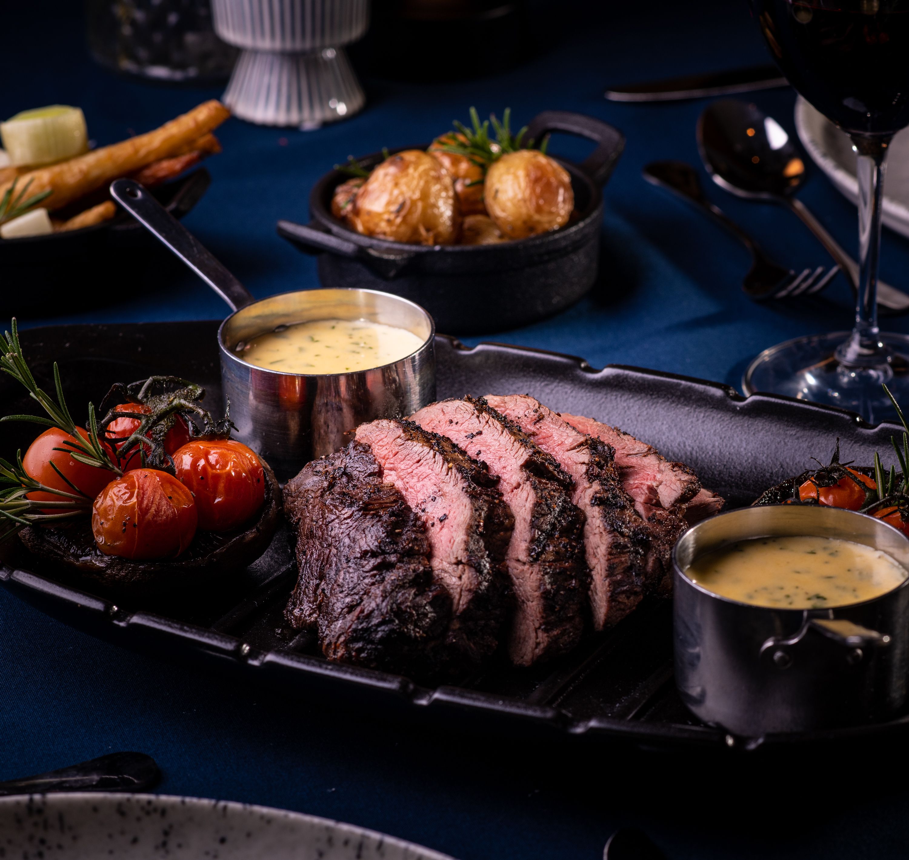 Close up of medium rare steak with peppercorn sauce