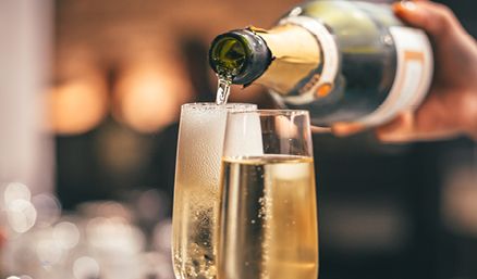 Glass of prosecco being poured