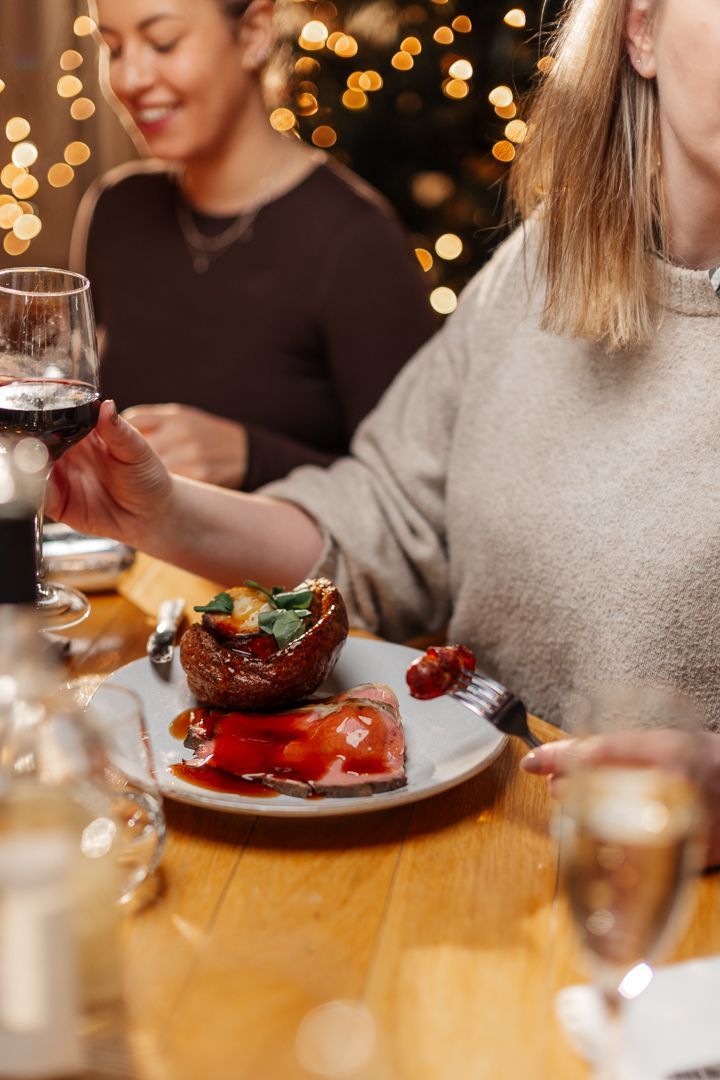 Lady eating roast dinner