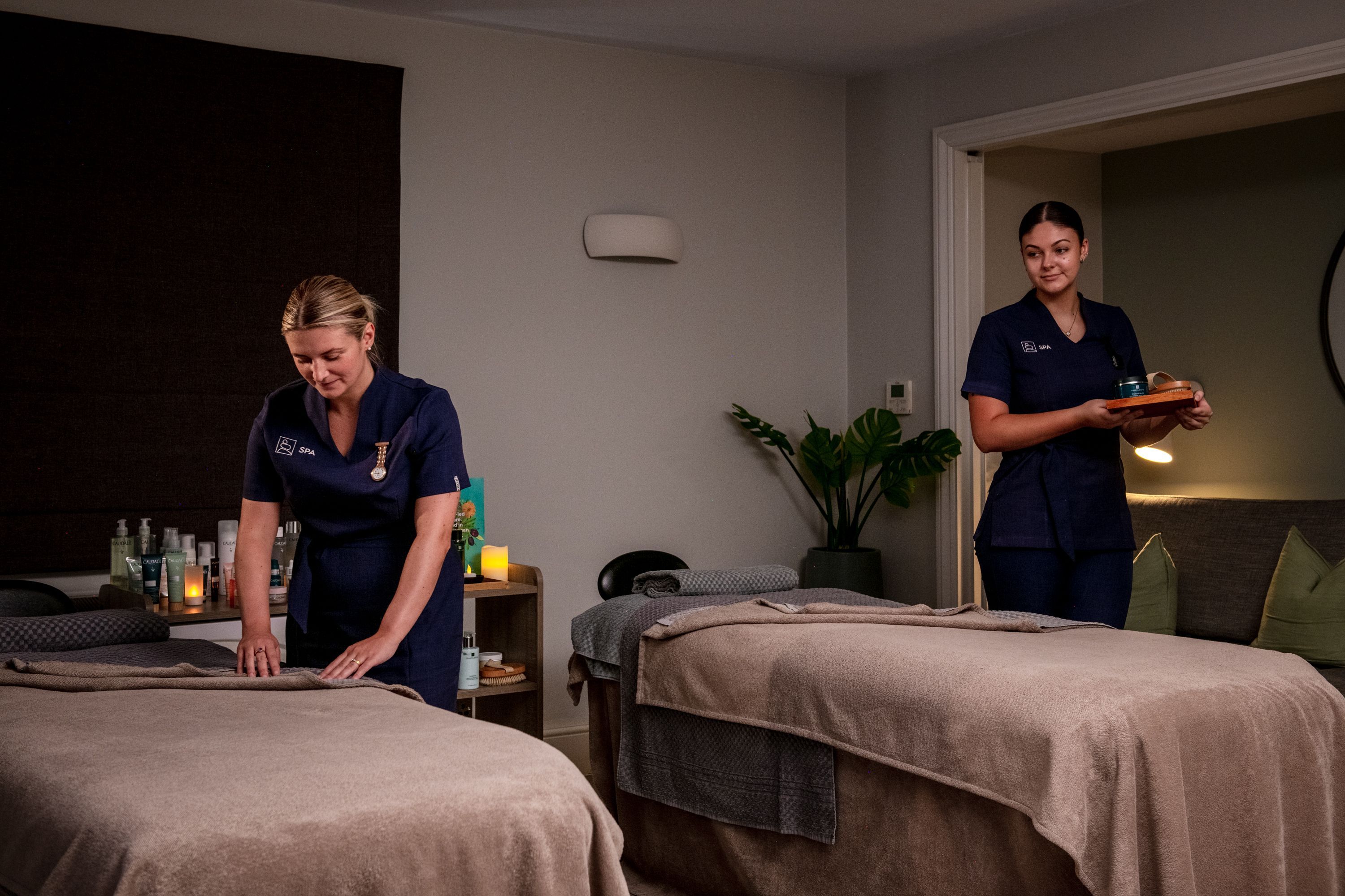 Spa therapists in treatment room